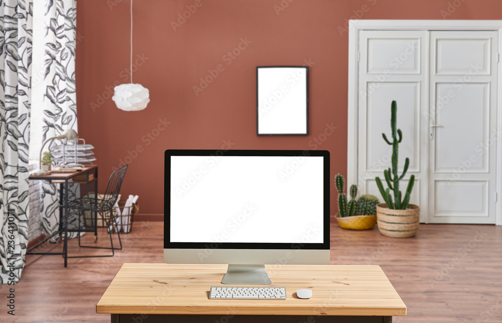 Wall mural brown living room background, close up desktop screen on the wooden desk.