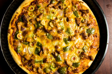 Pizza Pan take from top view with dark brown wood