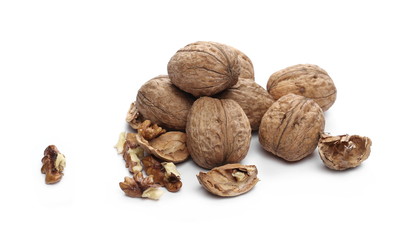 Cracked walnuts, isolated on white background