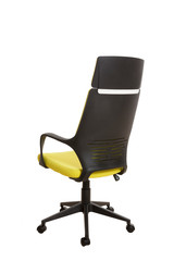 Back side view of a modern office chair, made of black plastic, upholstered with yellow textile. Isolated on white background.