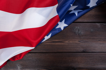 USA flag on dark wooden table background