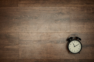 pointer clock on wood background