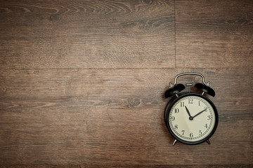 pointer clock on wood background