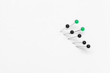 Group of pushpins isolated over white background