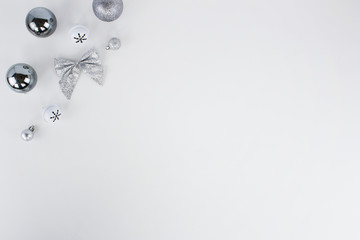 silver ribbons and balls in white background