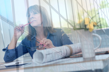 Architect working on plans, light effect, double exposure