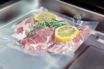 Sous vide steak with rosemary and lemons.