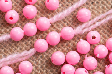 Colored plastic beads and thread