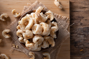 Pork rinds also known as chicharon or chicharrones , kab moo