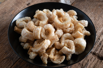 Pork rinds also known as chicharon or chicharrones , kab moo
