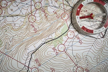 Fotobehang compass on the background of the map © Safikanov
