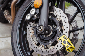 theft protection is mounted on the motorcycle brake disc
