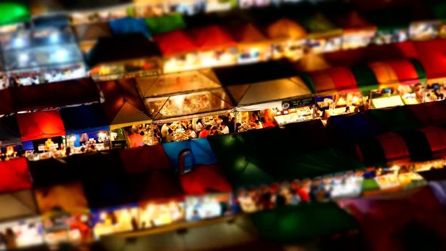 Miniature Time Lapse Night Train Market Ratchada at Bangkok, Thailand - Panning effect