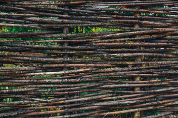 the fence of woven twigs