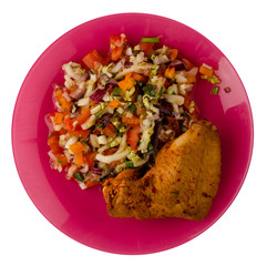 chicken wing with vegetable salad on a plate. chicken wing with vegetable salad isolated on white...