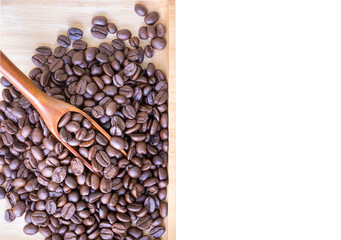 Coffee beans in wooden spoon  on white background