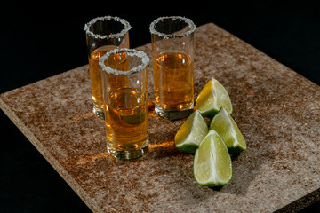 Golden tequila with lemon and salt. Drinks, Liquor