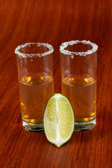 Golden tequila with lemon and salt. Drinks, Liquor