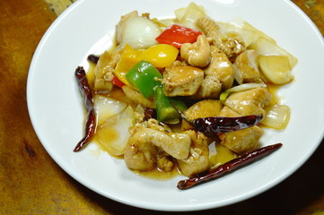 fried chicken with cashew nut and slice onion on plate