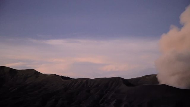 Smoke cloud erupting from Mt Bromo volcano Caldera National Park Java Indonesia