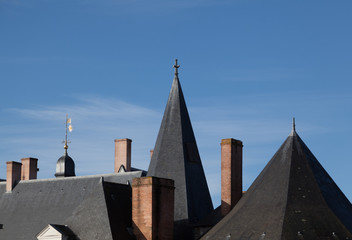 traditional france facade and roof in the city on Nantes in a sunny day with clear sky body copy