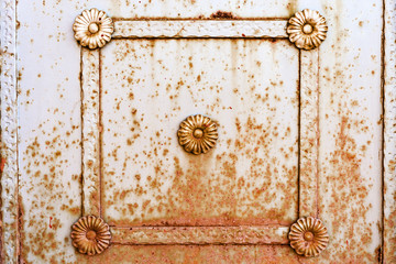 metal frame with a pattern on a rusty wall. background.