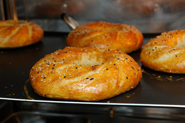 Freshly baked bread with sesame placed in electric stove