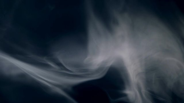 Smoke, fumes are spreading against dark background