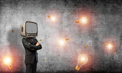 Businessman with old TV instead of head.