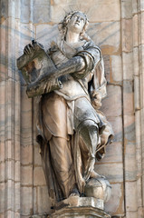 Obraz premium Statue of Saint on the facade of the Milan Cathedral, Duomo di Santa Maria Nascente, Milan, Lombardy, Italy