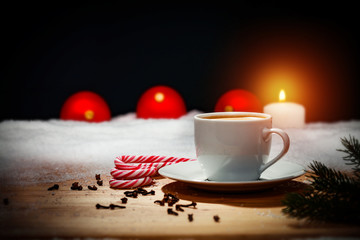 Christmas coffee on a wooden table in the candlelight  