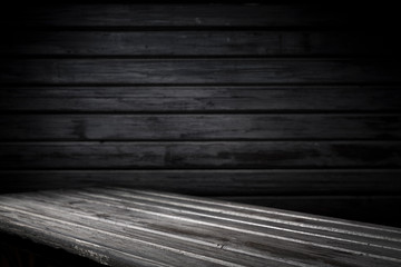 Dark room with tile floor and brick wall background