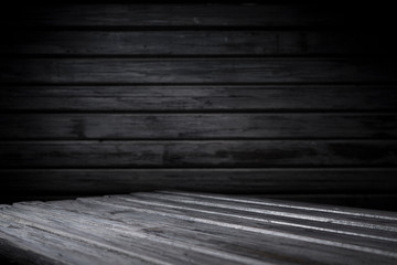 Dark room with tile floor and brick wall background