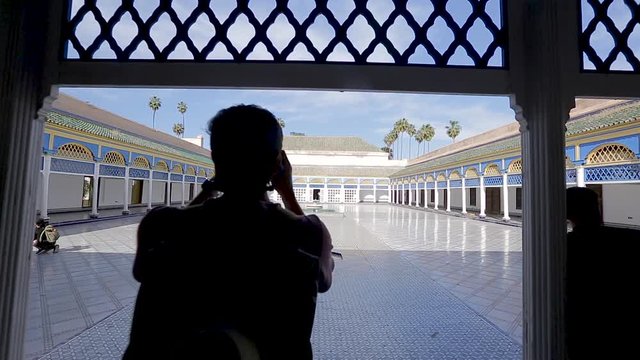 A tourist taking a picture in al badii palace in Marrakech