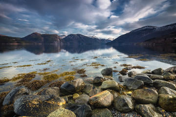 Shore of Sundalsfjorden, Trollheimen mountains in Norway.