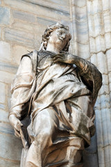 Obraz premium Saint Margaret, known as Margaret of Antioch, statue on the Milan Cathedral, Duomo di Santa Maria Nascente, Milan, Lombardy, Italy