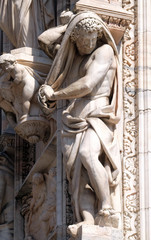 Atlantes supporting the main facade of the Milan Cathedral, Duomo di Santa Maria Nascente, Milan, Lombardy, Italy