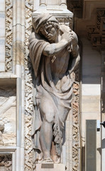 Atlantes supporting the main facade of the Milan Cathedral, Duomo di Santa Maria Nascente, Milan, Lombardy, Italy