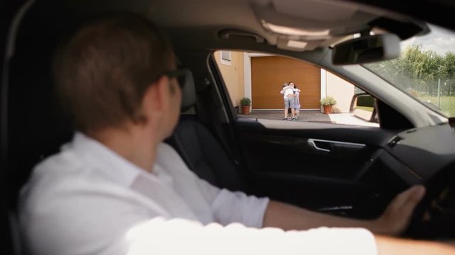 Dad drops his son off at his mum's house. Divorce family concept footage.