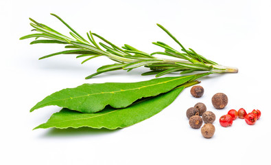 Traditional spices, rosemary branch, bay leaves, black pepper and rose