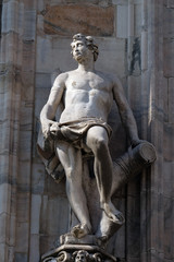 Obraz premium Statue of Saint on the facade of the Milan Cathedral, Duomo di Santa Maria Nascente, Milan, Lombardy, Italy