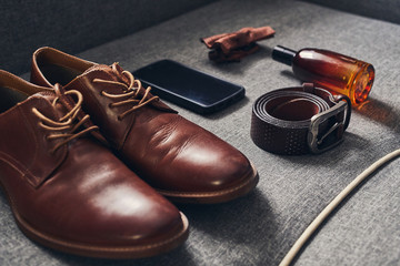 different accessories of a businessman for creating a style of a people lie on a wooden background