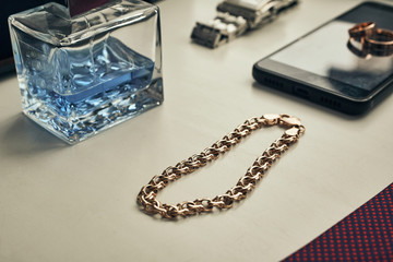 different accessories of a businessman for creating a style of a people lie on a wooden background