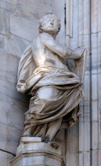 Obraz premium Statue of Saint on the facade of the Milan Cathedral, Duomo di Santa Maria Nascente, Milan, Lombardy, Italy