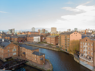 Aerial photo overlooking the Leeds City Center on a beautiful part cloudy day in West Yorkshire UK