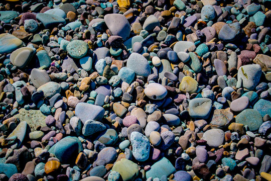 Colorful pebbles and rocks on Pantai Batu Biru, known as Blue Stone Beach or Penggajawa beach,  near Ende on Flores island in East Nusa Tenggara, Indonesia