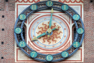 Fototapeta na wymiar Clock on the Sforza Castle in Milano, Italy, built in the 15th century by Francesco Sforza, Duke of Milan, on the remnants of a 14th-century fortification