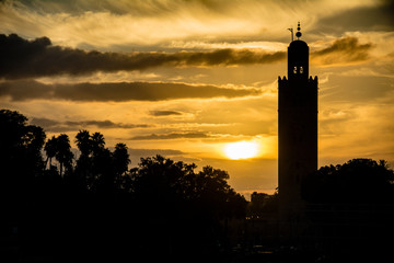 Marrakesh mosque in silhouette at sundown in Morocco