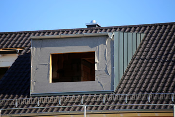 Constructing a dormer (Roofer, Carpenter, Plumber)