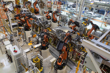 body of car on conveyor top view. Modern Assembly of cars at the plant. The automated build process...